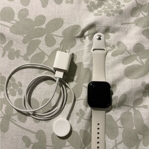 Apple White Smartwatch with Silicone Band and Magnetic Charger Cable